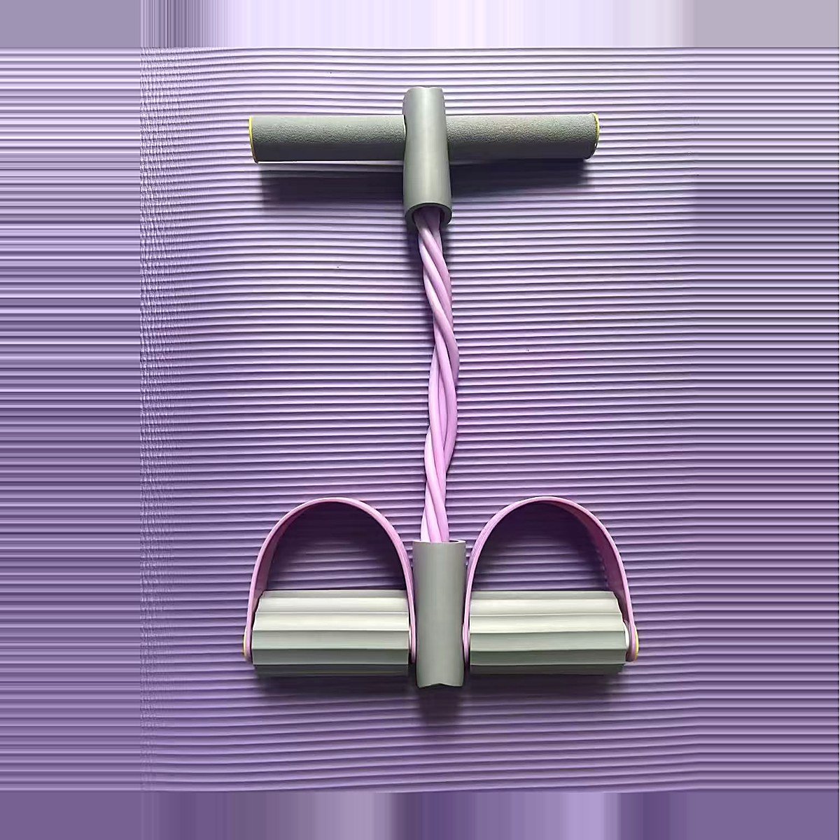 Grey and purple pedal resistance band standing upright
